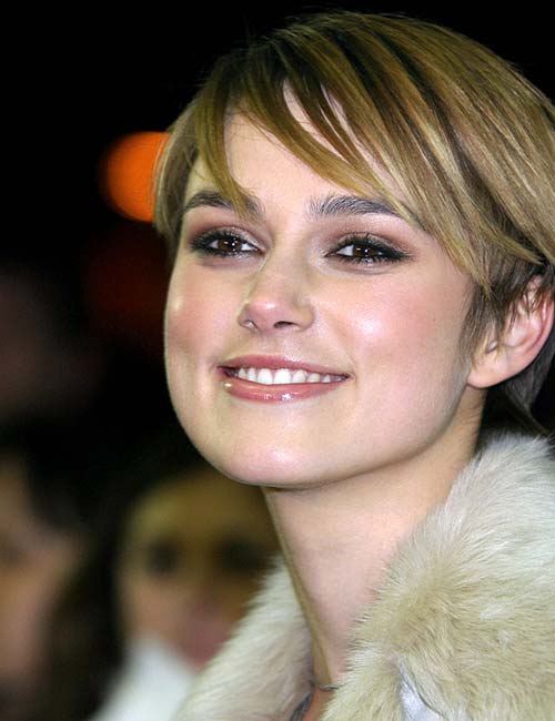 Short edgy dirty blonde pixie cut hairstyle