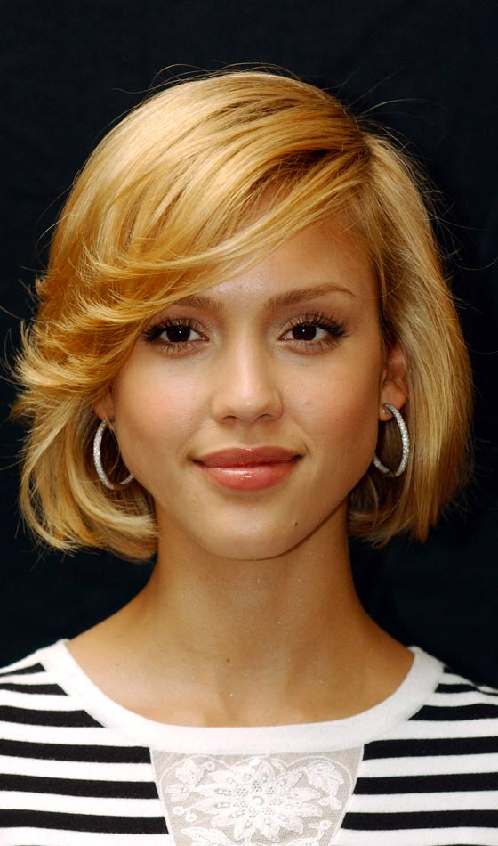 Round bob hairstyle with side-swept flips for oval faces