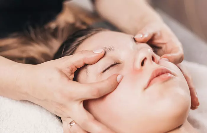 Massaging the area around the eyes