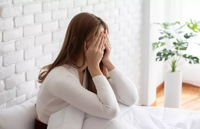 Woman having headache after skipping breakfast regularly