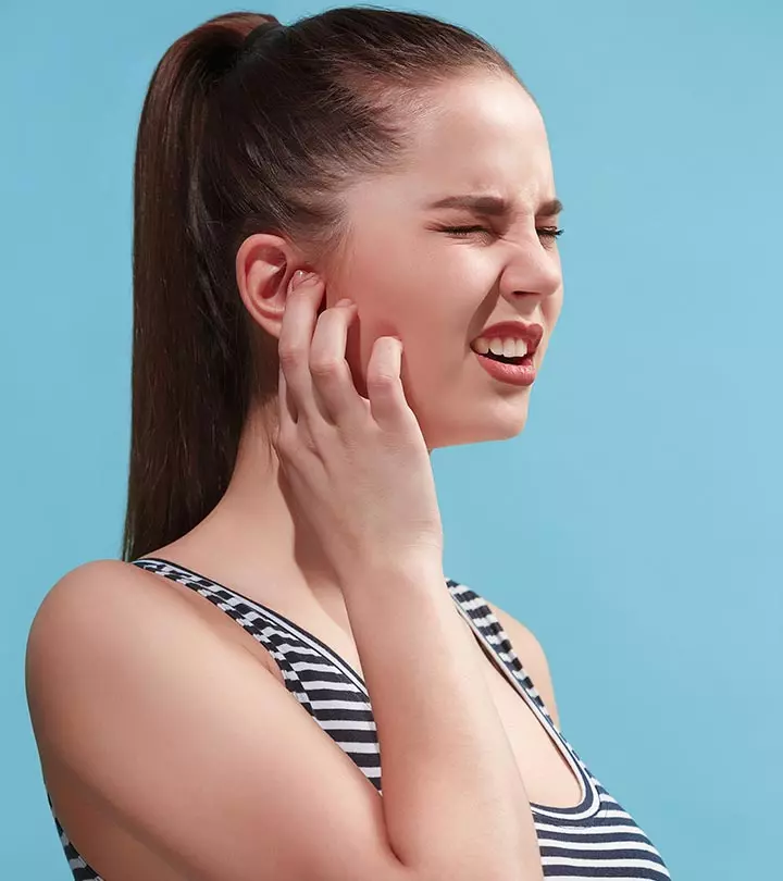 A Women With Dry Skin In Ears