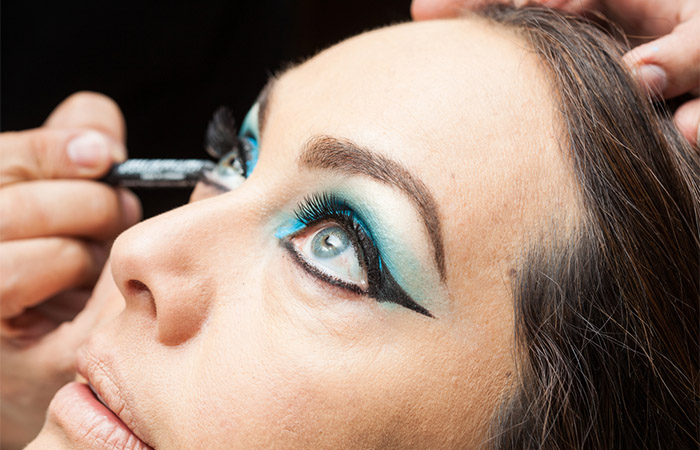 Bold ocean blue colored eyeshadow as a makeup for blue green eyes
