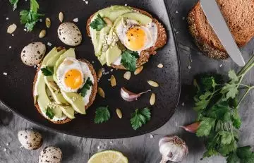 A spread of avocado and quail egg toast as part of a detox diet