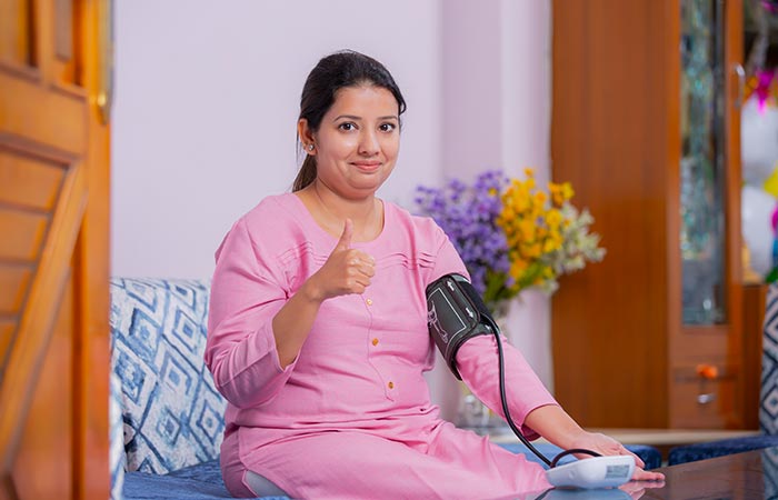 Woman checking her blood pressure 