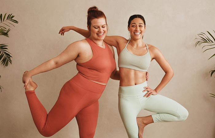 Two different-sized women in workout gear