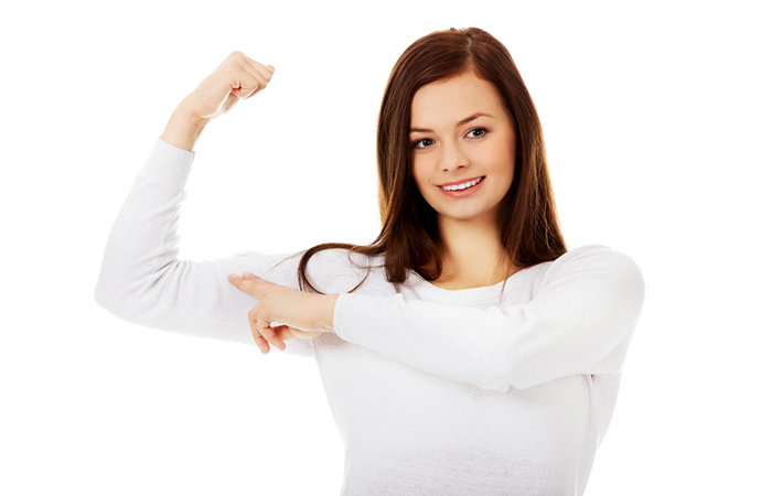 Woman flexing her strong arms