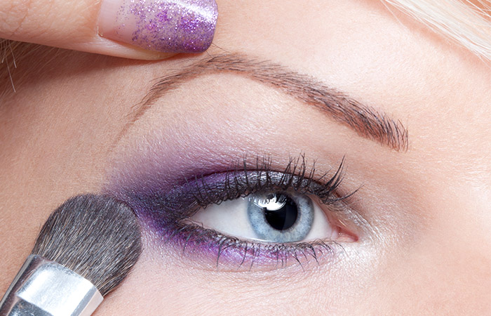 Violet eyeshadow as a makeup for blue green eyes
