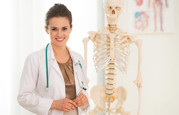 Doctor showing bone health with a skeleton