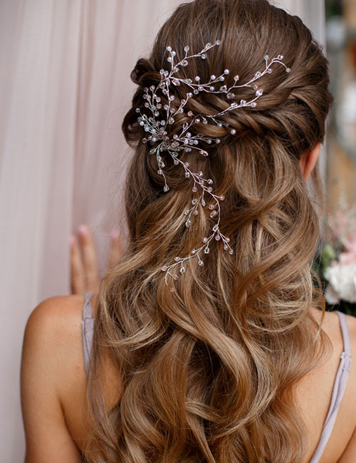 Criss-crossed braids half up-half down prom hairstyle