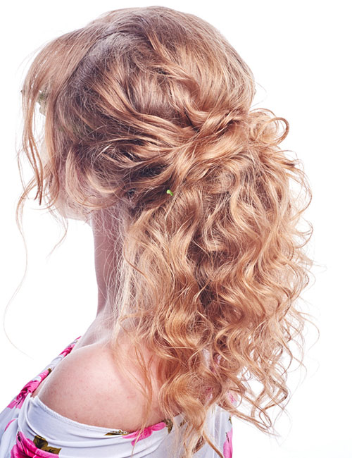 Curly twisted half up-half down prom hairstyle