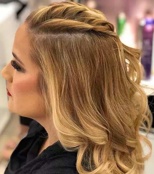 French braid half up-half down prom hairstyle with side twist
