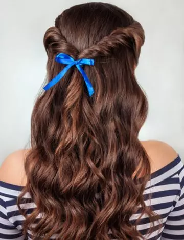 Knotted flip half up-half down prom hairstyle