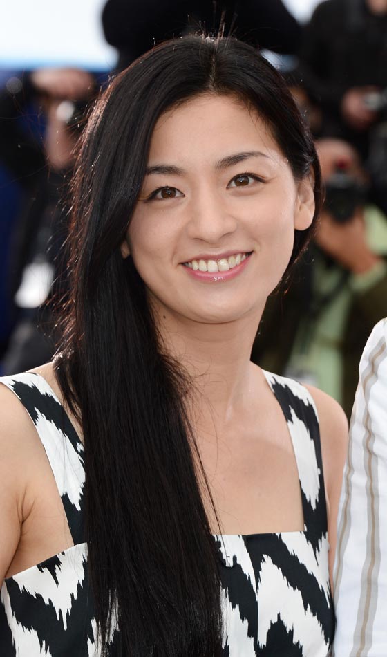 Machiko Ono acing the long, side parted symmetric hairstyle