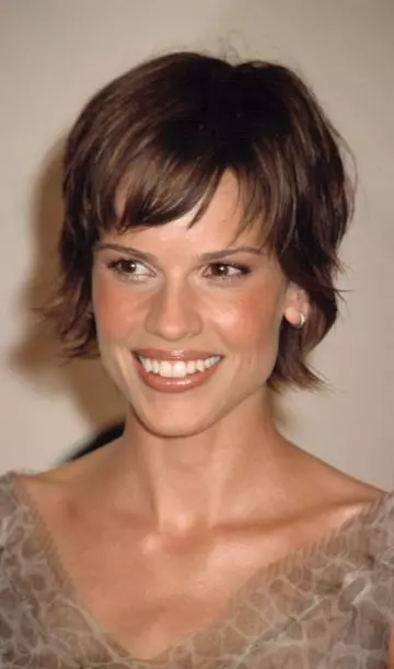 Long pixie with side-swept bangs as a symmetric hairstyle