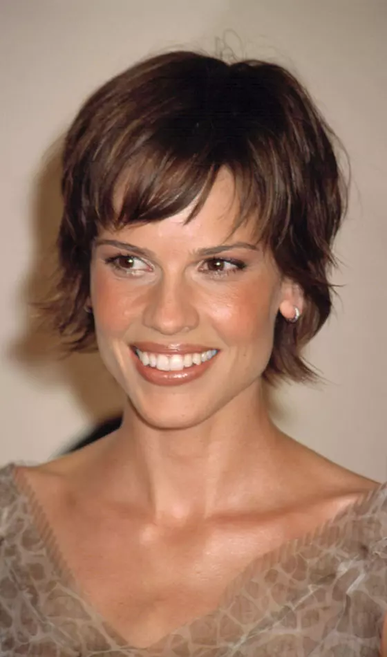 Long pixie with side-swept bangs as a symmetric hairstyle