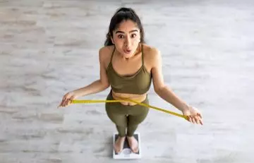 Woman on a weighing scale