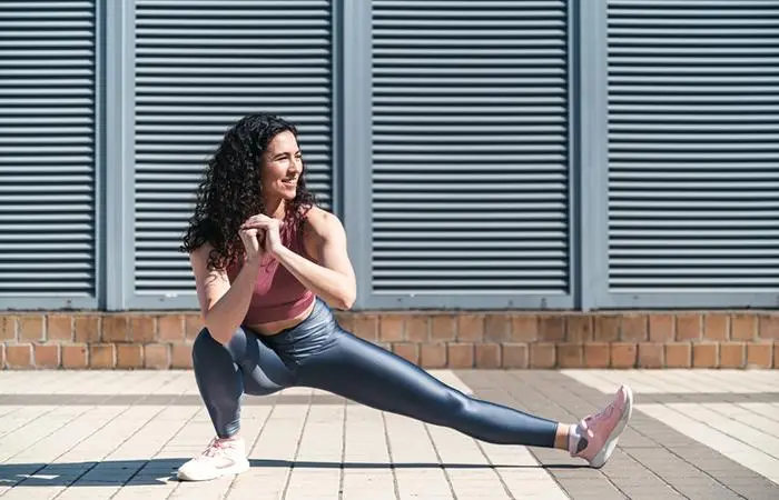 Woman performing side lunges