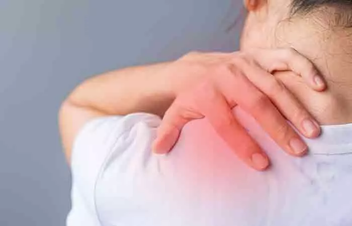 Woman experiencing shoulder pain