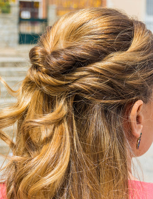 Twisted pretty half up-half down prom hairstyle