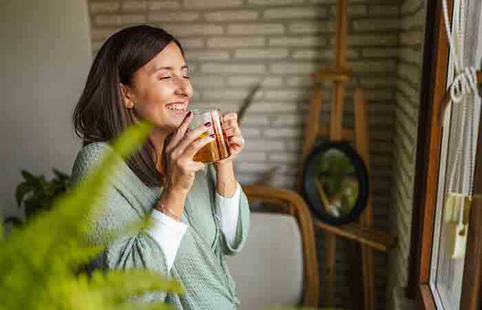 Woman drinking buckwheat tea to boost immunity and heart health