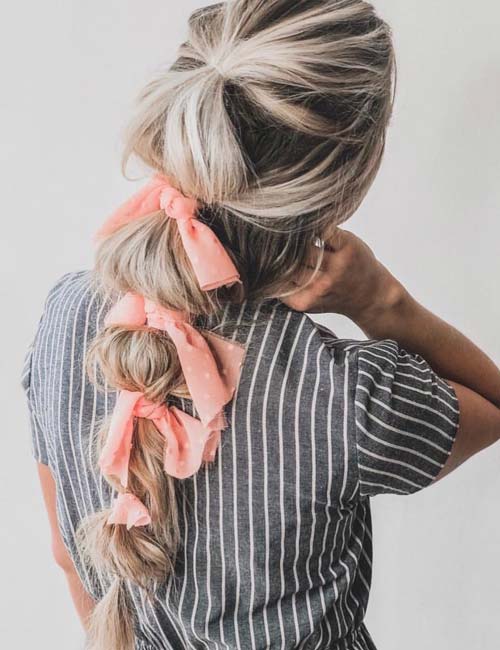 Multiple scarves on a ponytail braid