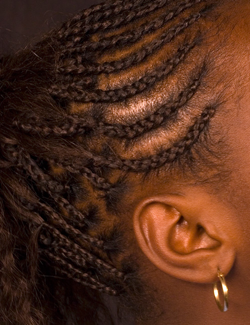 Pulled back half cornrows braids hairstyle