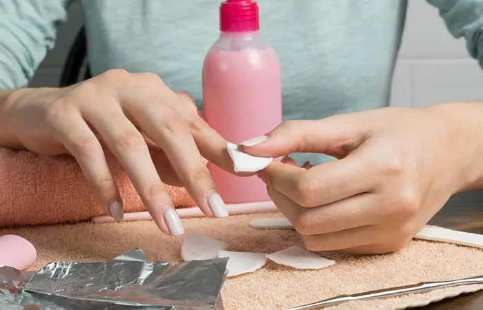  A woman removing her nail polish