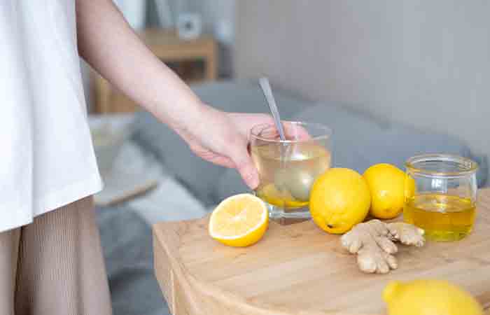 Man taking honey water with lemon and ginger before bed for good sleep