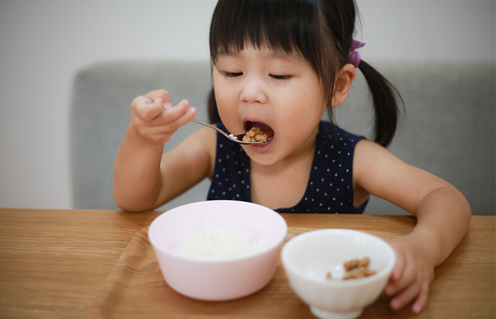 Girl eating natto rice