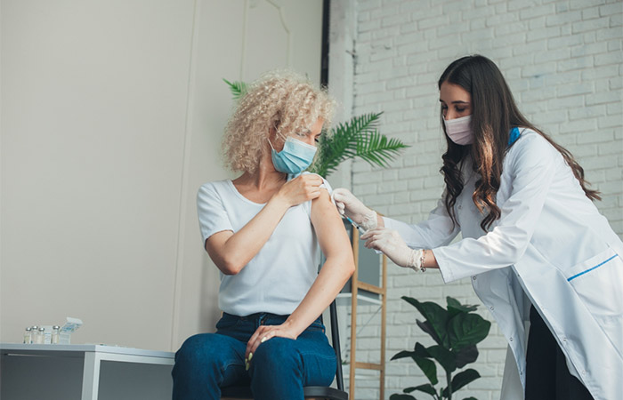 Woman getting glutathione injections for skin brightening