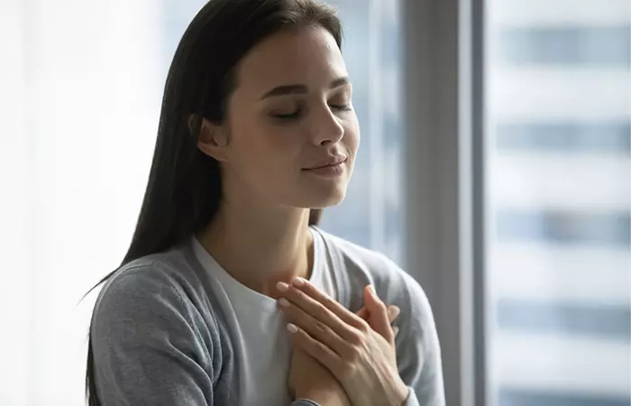 Woman hold hands at heart portraying good heart health