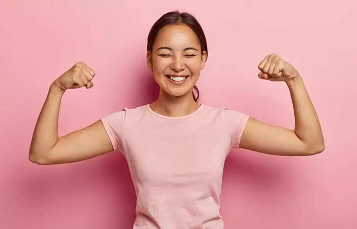 Woman showing strong arms and biceps