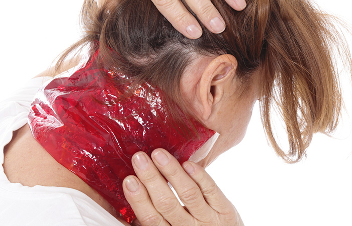 Woman applying cold compress on hickey