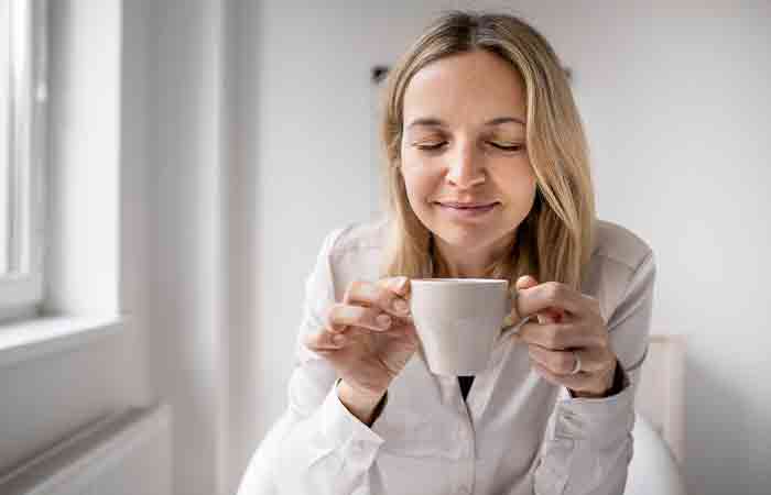 Woman drinks corn silk tea to balance mineral levels in body