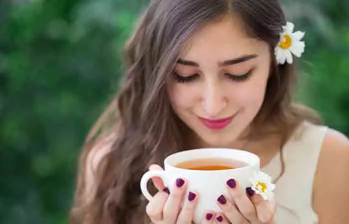 Woman holding corn silk tea