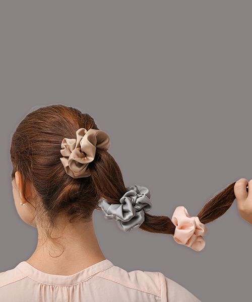 Double tie or triple tie ponytail hairstyle