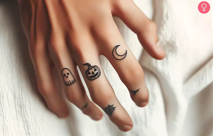 A minimalist Halloween theme outline tattoo on the fingers