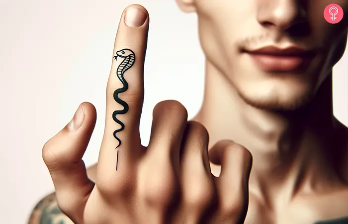 A minimalist cobra outline tattoo on the index finger