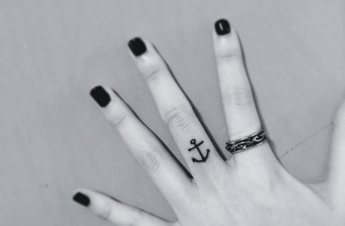 Anchor tiny finger tattoo