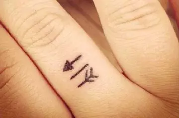 Arrow tiny finger tattoo