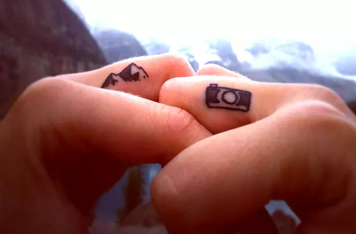 Camera tiny finger tattoo