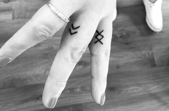 Chevron tiny finger tattoo