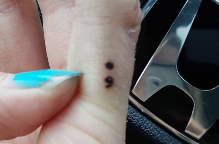 Semi colon tiny finger tattoo