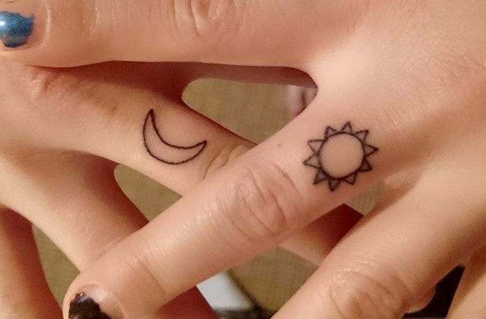 Sun and half moon tiny finger tattoo