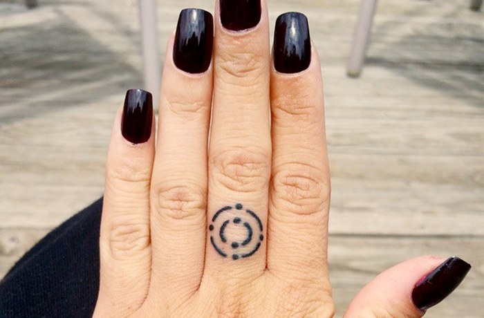 Carbon tiny finger tattoo