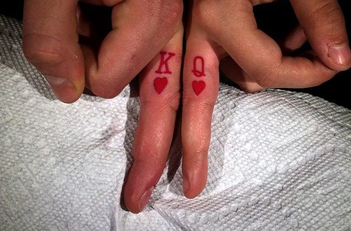 King and queen of hearts tiny finger tattoo