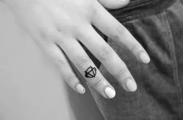 Sobriety symbol tiny finger tattoo