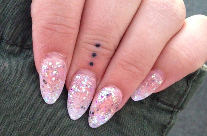 Three dots tiny finger tattoo
