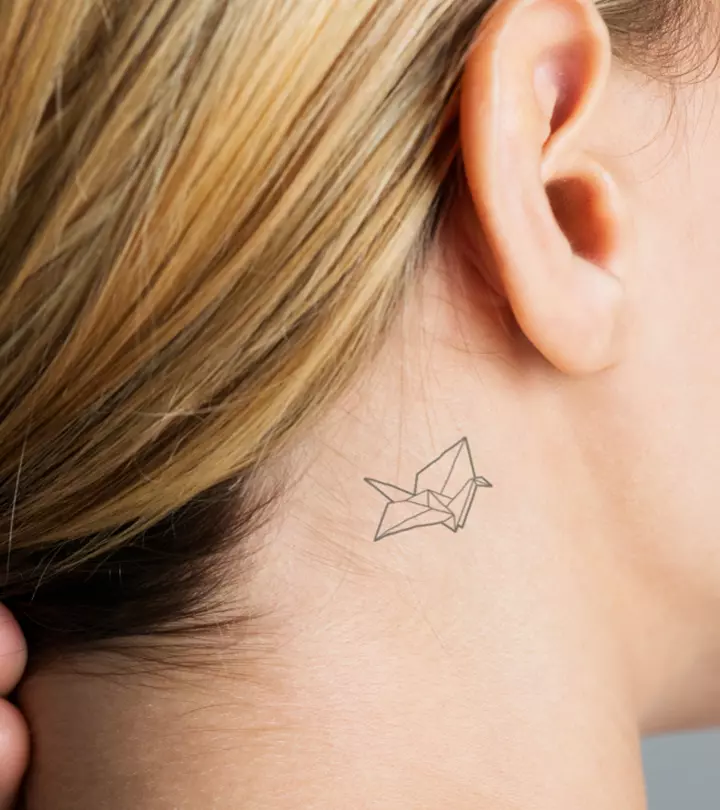 A woman with a tiny tattoo under her ear
