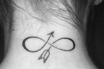 Bent arrow tiny tattoo